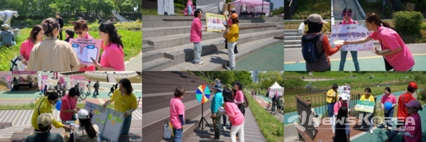 IWPG 평화 활동가들이 양재천에서 시민들에게 ‘세계여성평화의 날’ 캠페인 활동을 하고 있다. @IWPG